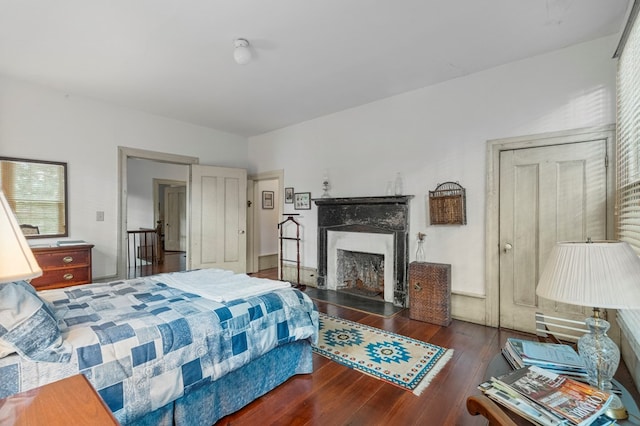 171 Jefferson Ave, Talbotton, GA 31827 - bedroom with wood finished floors and a premium fireplace