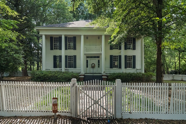 171 Jefferson Ave, Talbotton, GA 31827 - neoclassical home with a fenced front yard and a porch