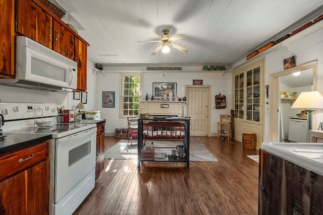 171 Jefferson Ave, Talbotton, GA 31827 - kitchen with dark wood finished floors, dark countertops, ceiling fan, and white appliances