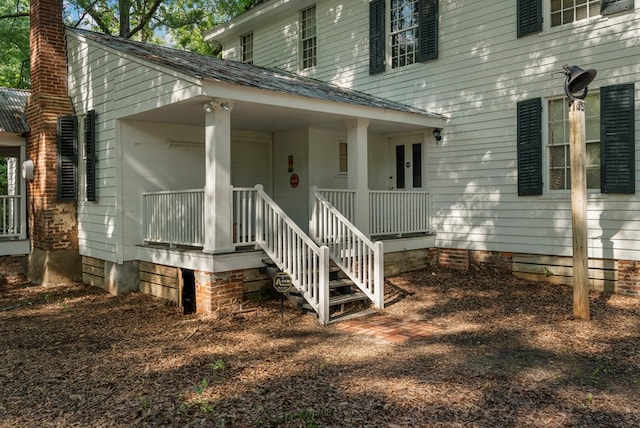 171 Jefferson Ave, Talbotton, GA 31827 - view of exterior entry featuring a porch, crawl space, and a chimney