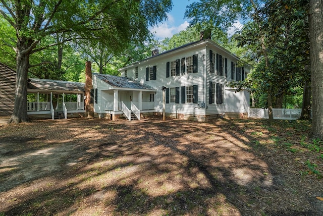 171 Jefferson Ave, Talbotton, GA 31827 - back of house featuring fence, covered porch, and a chimney