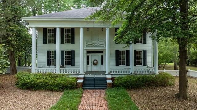 171 Jefferson Ave, Talbotton, GA 31827 - greek revival house with a porch and a balcony