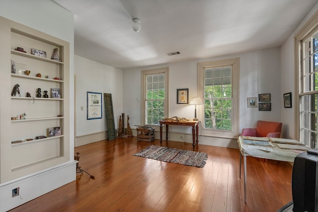 171 Jefferson Ave, Talbotton, GA 31827 - interior space featuring visible vents, built in features, wood finished floors, and a healthy amount of sunlight
