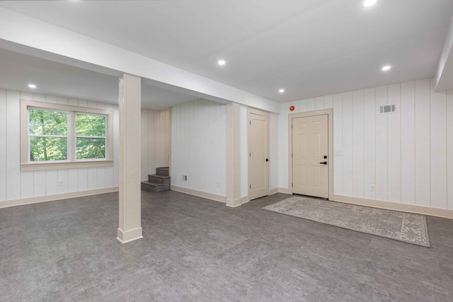340 Commadore Dr, Hamilton, GA 31811 - below grade area with stairs, carpet flooring, recessed lighting, and wood walls