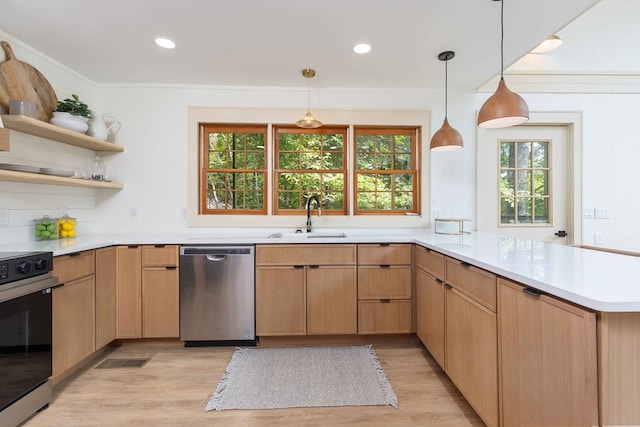 340 Commadore Dr, Hamilton, GA 31811 - kitchen with dishwasher, electric range, a peninsula, light wood finished floors, and light countertops