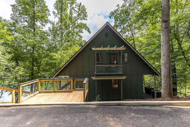 340 Commadore Dr, Hamilton, GA 31811 - view of front of house with board and batten siding and a deck