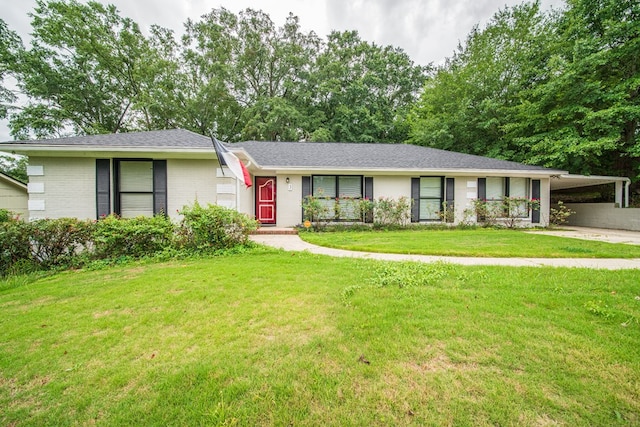 3 Primrose Ct, Columbus, GA 31907 - ranch-style home with an attached carport, brick siding, a front yard, a shingled roof, and concrete driveway