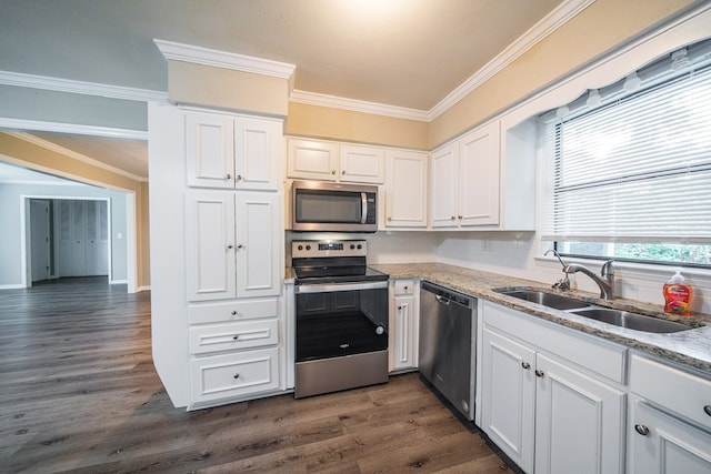 3 Primrose Ct, Columbus, GA 31907 - kitchen with stainless steel appliances, crown molding, white cabinetry, light stone countertops, and dark wood finished floors