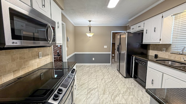 kitchen with white cabinetry, sink, stainless steel appliances, and hanging light fixtures