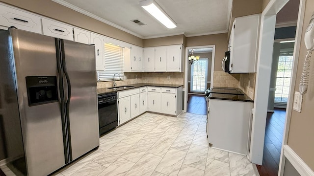 kitchen featuring sink, crown molding, tasteful backsplash, stainless steel appliances, and white cabinets