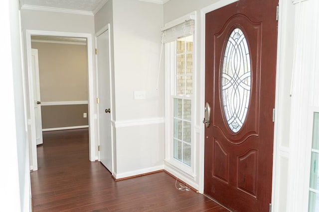 entryway featuring dark wood-type flooring and ornamental molding