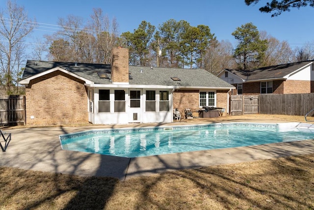 view of swimming pool with a lawn and a patio