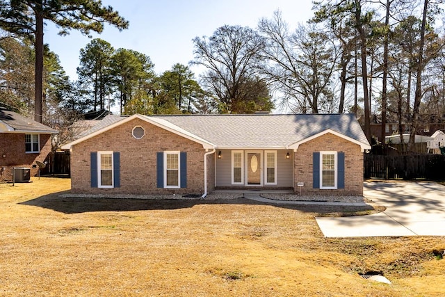 single story home featuring cooling unit