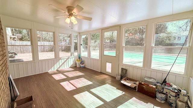 unfurnished sunroom featuring vaulted ceiling and ceiling fan