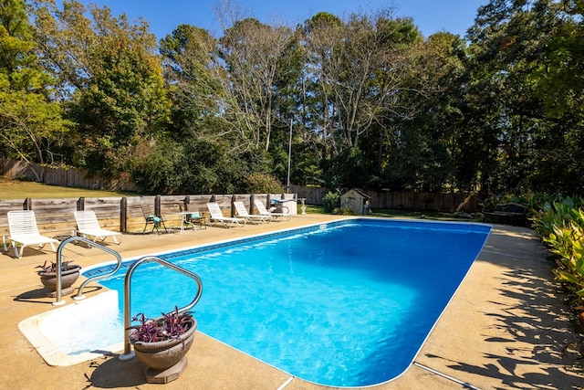 view of swimming pool with a patio