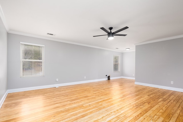 empty room featuring ceiling fan, light wood-type flooring, and ornamental molding