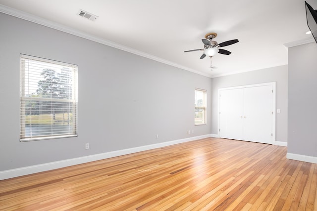 unfurnished room with ceiling fan, light hardwood / wood-style flooring, and ornamental molding