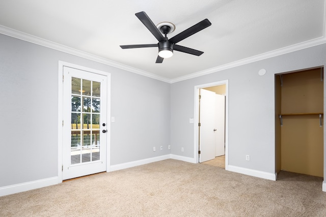 unfurnished bedroom with ceiling fan, access to exterior, light carpet, and crown molding