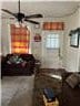 1228 12th Ct, Phenix City, AL 36867 - living area featuring a ceiling fan