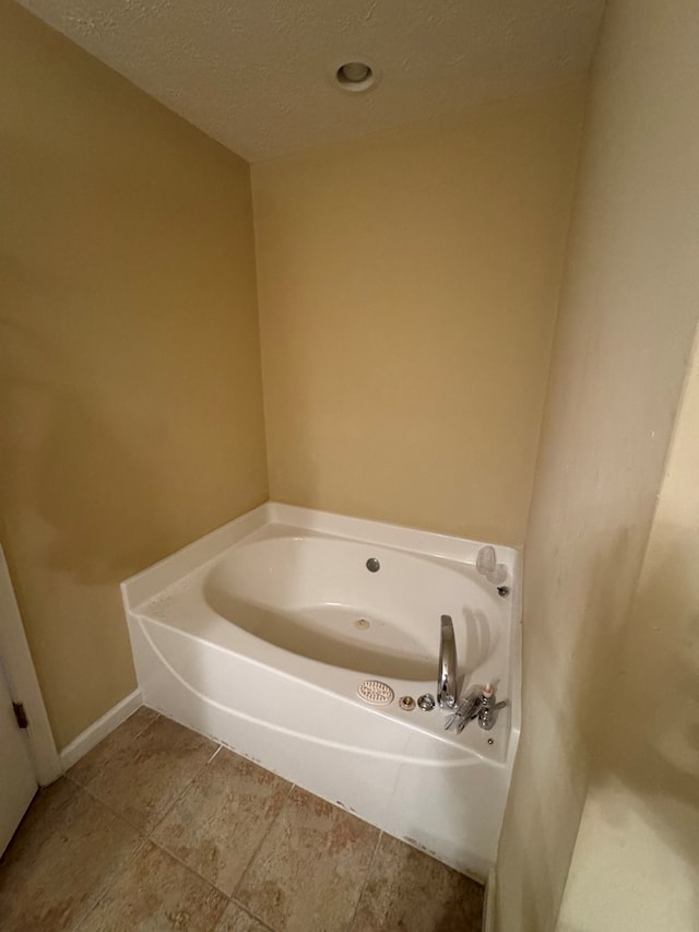 3802 Holland Ct, Phenix City, AL 36867 - full bathroom with a bath and a textured ceiling