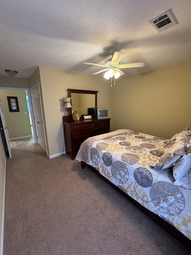 3802 Holland Ct, Phenix City, AL 36867 - bedroom featuring carpet floors, a ceiling fan, and a textured ceiling