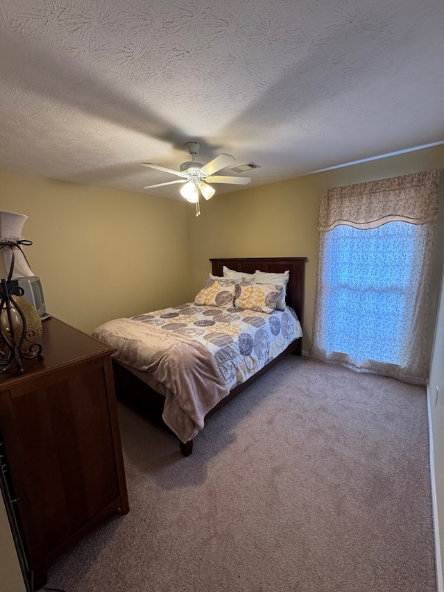 3802 Holland Ct, Phenix City, AL 36867 - bedroom featuring carpet flooring, ceiling fan, and a textured ceiling