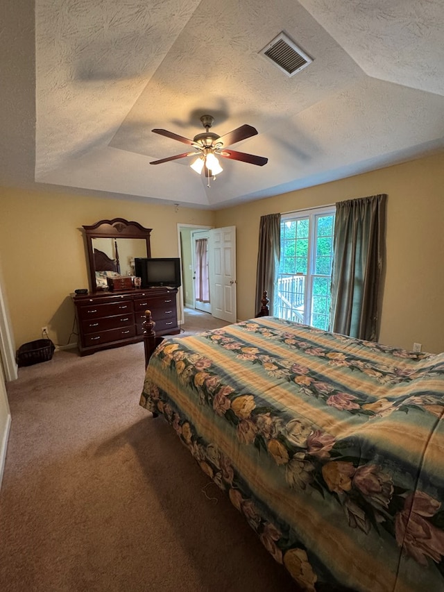 3802 Holland Ct, Phenix City, AL 36867 - bedroom with light carpet, a textured ceiling, a ceiling fan, and access to exterior