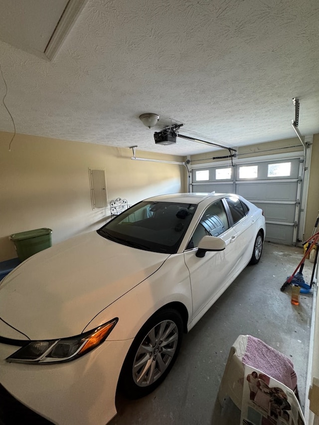 3802 Holland Ct, Phenix City, AL 36867 - garage featuring a garage door opener and electric panel
