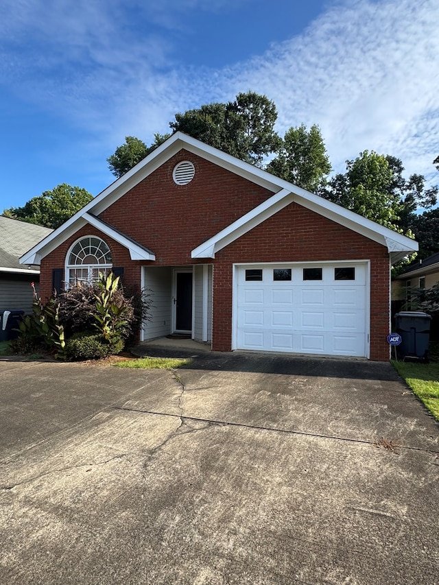 3802 Holland Ct, Phenix City, AL 36867 - ranch-style home featuring brick siding, concrete driveway, and a garage