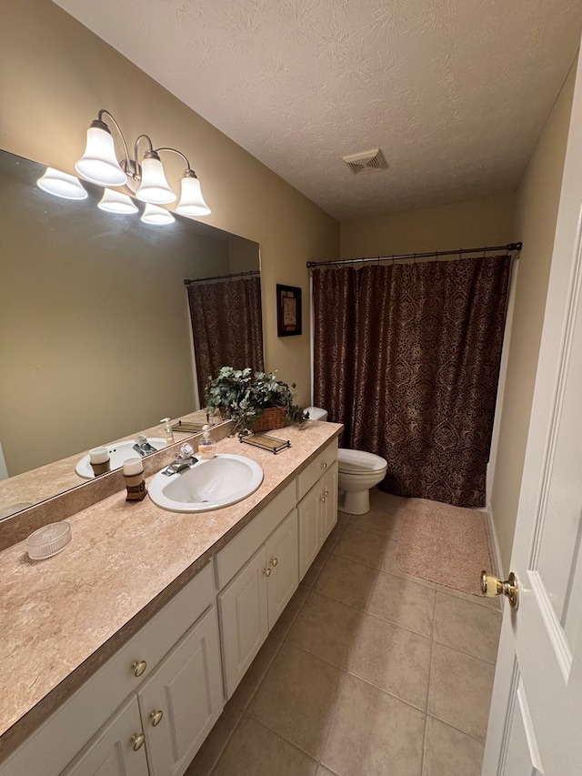 3802 Holland Ct, Phenix City, AL 36867 - bathroom with vanity, tile patterned flooring, and a textured ceiling