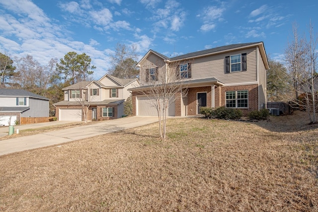 view of property featuring central AC unit, a garage, and a front lawn