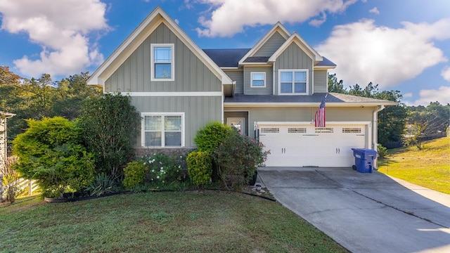 craftsman inspired home featuring a front lawn and a garage