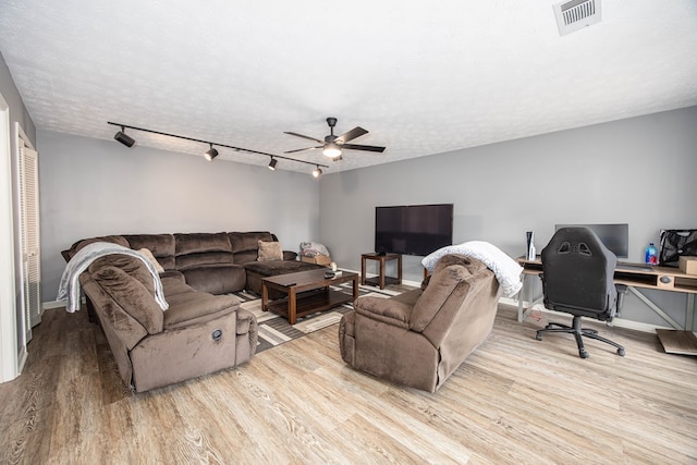6909 Trapper Way, Midland, GA 31820 - living area with wood finished floors, a ceiling fan, and an office area