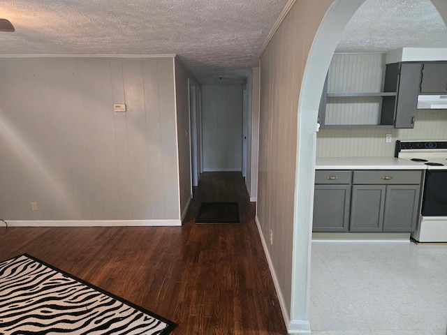 1704 18th St, Phenix City, AL 36867 - hallway featuring arched walkways, a textured ceiling, light wood finished floors, and crown molding