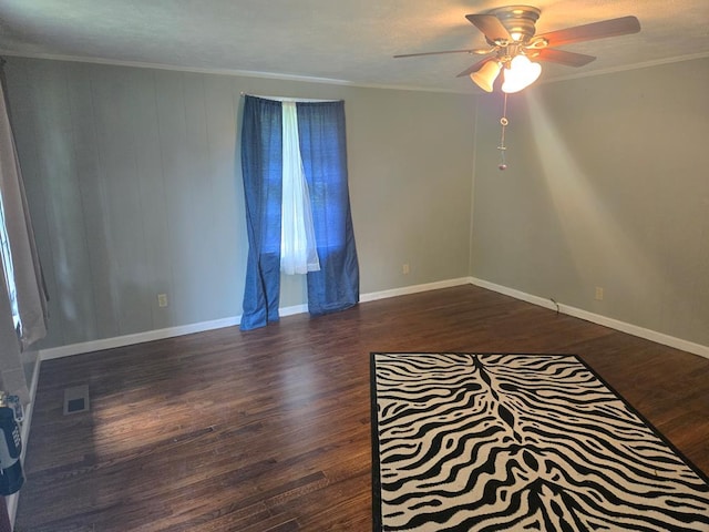 1704 18th St, Phenix City, AL 36867 - empty room with a ceiling fan, dark wood-style floors, and crown molding