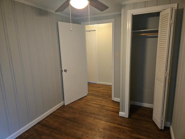 1704 18th St, Phenix City, AL 36867 - unfurnished bedroom with dark wood-style flooring, crown molding, a closet, and ceiling fan