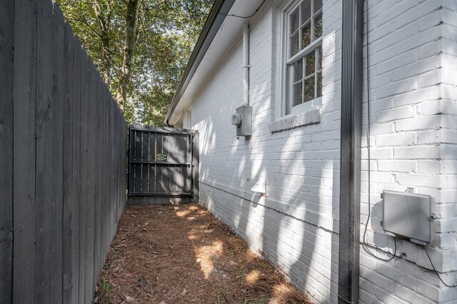 view of home's exterior featuring fence