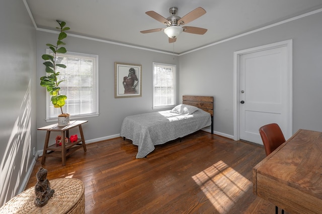 bedroom featuring crown molding, multiple windows, and wood finished floors