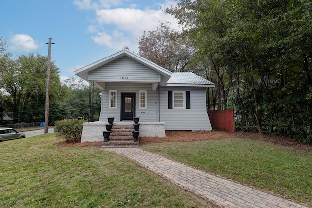 bungalow with a porch and a front yard