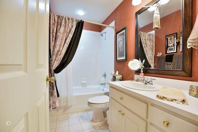 full bathroom with tile patterned floors, shower / bath combo with shower curtain, vanity, and toilet