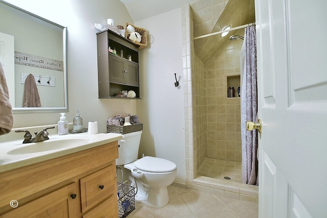 bathroom featuring curtained shower, tile patterned flooring, vanity, and toilet