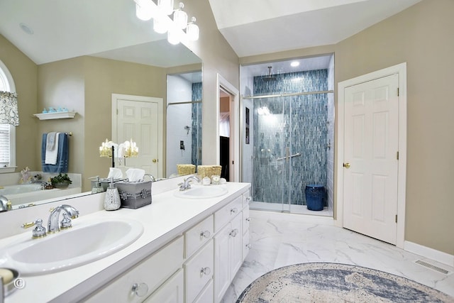 bathroom featuring vanity and an enclosed shower