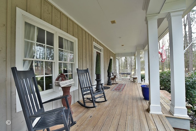 wooden terrace with covered porch