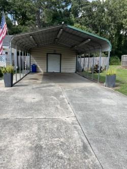 view of parking with a carport