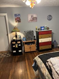 bedroom featuring dark hardwood / wood-style flooring and a textured ceiling