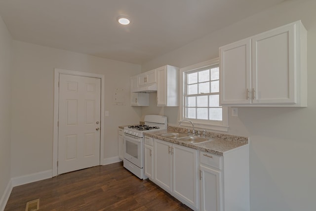 kitchen featuring white cabinets, dark wood-style flooring, a sink, and white range with gas stovetop
