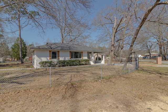 ranch-style house with a fenced front yard