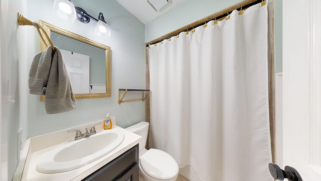 bathroom with toilet and vanity