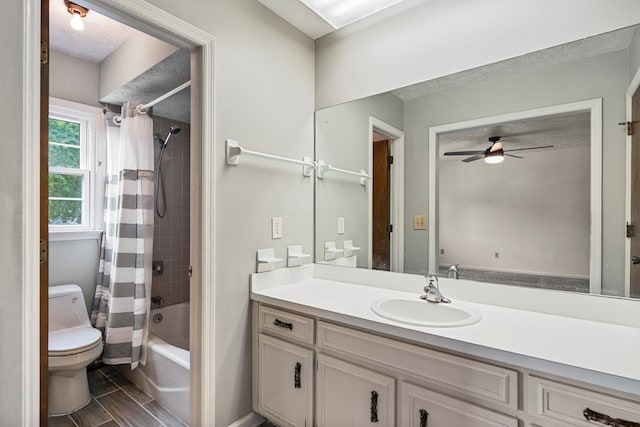 3925 Chris Dr, Columbus, GA 31909 - bathroom featuring toilet, shower / tub combo with curtain, vanity, ceiling fan, and wood tiled floors