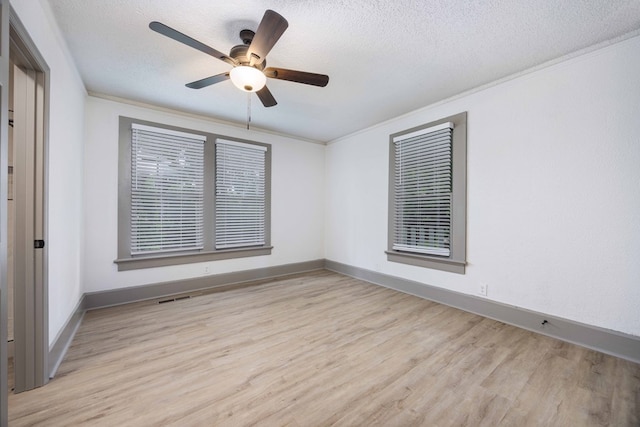 5855 Morningside Dr, Columbus, GA 31909 - empty room featuring light wood finished floors, ornamental molding, a textured ceiling, ceiling fan, and baseboards
